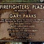 A bronze plaque is fixed in the walkway at the Gary Parks memorial outside the Everett Community College library. (Dan Bates / Herald file)