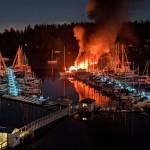 After an explosion shook Burton early Monday morning, two 40-foot fiberglass vessels caught fire and sunk. The cold weather made the Quartermaster Marina dock slippery for firefighters putting out the fire (Matt Wilson Photo).