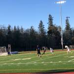 Sophomore striker Nick Zuckerman controls play; senior Zach Van Dusen looks on (Linnea Heuschert Photo).