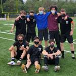 Seniors Chris Fontina, Bassam Almustafa, Ethan McIntyre, Jesse Townsend, Jakob Heuschert (top row from left to right), Zach Van Dusen, Will Kim, and Alec Macomber-Straight (bottom row from left to right) pose after Senior Night (Bellamy Cox Photo).