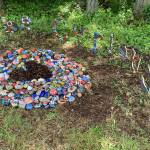 Guided by island artist Britt Freda, students installed painted rocks at the entrance to the school on Cemetery Road. A public unveiling of the exhibit, BE CURIOUS: compassion and kindness rocks! took place earlier this month (April M. Wilkinson Photo).