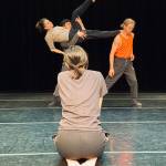 Seattle Dance Collective dancers, rehearsing new work by Robyn Mineko Williams, who is seated in the foreground (Photo Courtesy Seattle Dance Collective).