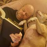 Phil Clapham shares his passion for books with a special friend (Courtesy Photo).