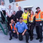 (Terry Donnelly Photo) Captain Marsha Morse, far left at the top of the stairs, and her crew, photographed aboard the MV Kitsap.