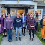 (Tom Hughes Photo) The DOVE team gathered to celebrate First Friday on Oct. 1, after a long day of helping 50 local businesses set up signage and purple lights to mark awareness and share support for survivors of domestic violence in October. An art exhibit also took place in the living room of the agencys building. Front row: Tessa Carroll, Maya B., Rashaun Renggli and Collin Veenstra. Back row: Linda Stemer, Tracy McLaren, Nyn Grey, Heidi Jackson and Kyle Britz.