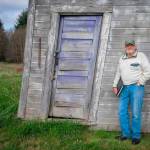 Terry Donnelly Photo
Bruce Haulman with his trusty notebook, leaning against the Mukai equipment shed, which has since been removed, at the National Register and King County Landmark Mukai Agricultural Complex.