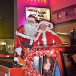 (Photo Courtesy Jim Diers) Santa and Mrs. Claus greeted onlookers as they headed down the streets of Vashon via a festive red pickup truck on Saturday.