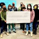 (Photo Courtesy Donna Nespor) The Vashon Schools Foundation presented a check for $102,000 to the VISD board during their meeting on Thursday, Jan. 13.