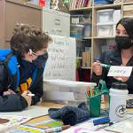 Peter Woodbrook Photo
Angie Pinto Bolanos, from Bogota, Colombia, works with one of her first-grade students at Chautauqua Elementary School.