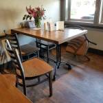 (Dorinda Kopp Photo) An empty chair, and a table set with cards and flowers, marked the death of a faithful customer, Nathan Dorn, Jr., at Sportys last week.