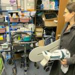 (File Photo) Kim Eckhardt, a physical therapist, picks up equipment for patients from the care closet at Vashons Lutheran Church in 2019.