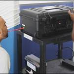 (Courtesy photo) <em>Breathe in… Breathe out  New COVID Test: Newly Authorized System Uses Breathalyzer Tech. </em>Eventually, a new analysis technology could take the place of nose-tickling rapid and PCR tests. The FDA has granted authorization to the small Texas company InspectIR for its laboratory in a box, a mobile COVID testing system. The 40-pound unit is a miniature mass spectrometer and can deliver a COVID test result in three minutes from the time a patient blows into a single-use straw inserted into a port on the side of the box. The analysis heats and ionizes the sample so it self-sterilizes before the next use. It will be some time before the machine is in wide use since the company at this time can only build 500 units per month.