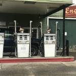 (Christine Carpenter Photo) Vases of flowers sit atop the gas pumps at Engels Repair & Towing.