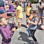 (Jim Diers Photo) Kids, having fun with bubbles, at the 2021 Strawberry Festival.