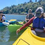 Photo courtesy of Michael Kollins
A volunteer measures the kelp forest depth off Vashons northern shoreline.