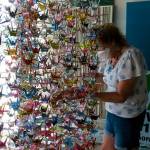 Alice Larson straightened the origami cranes on her artwork after moving it to Voice of Vashon. (Peter Ray Photo)