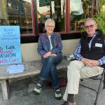 Commissioners Wendy Noble (left) and Tom Langland sat for almost three hours outside of The Hardware Store Restaurant during last Fridays gallery cruise, engaging with islanders about the future of sustainable health care on Vashon (Elizabeth Shepherd Photo).