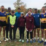 BBRC Rowers Taylor Huffman, left, and Ella Jones, right, pose for a picture with rowers from the Ukrainian National Team at the Head of the Charles Regatta (Richard Parr Photo).