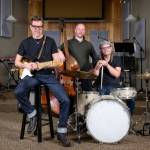 In Drama Docks production opening on Nov. 10, (left to right), Billy Joe Huels stars as legendary 1950s rock and roll star, Buddy Holly, with Gavin Kovite as bass player Joe Mauldin, and Kelly Van Camp as drummer Jerry Allison  all members of Buddys legendary band, the Crickets (Jeff Dunnicliff Photo).