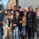Sweeney Todd cast members took a break from rehearsing the musical, last Saturday, to bask in a rare moment of sunshine outside of Vashon Center for the Arts last Saturday. Pictured front row, left to right, are Arlette Moody, Amy Cole, Stephanie Murray, Bradley J. Thomas and Hailey Howell Quackenbush. The cast members in the back row, left to right, are Matt Wilson, Chris Boscia, Max Lopusynski, Miles Wingett, and Erika Strandberg (Tom Hughes Photo).