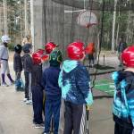 Players line to practice at the first preseason hitting clinic held by Vashon Youth Baseball and Softball (Eric Frith Photo).