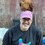 Phil Levin, who moved to Vashon three years ago, shared his enthusiasm for his new island home in this photo, featuring a fine, feathered friend sitting atop his head. (Elizabeth Braverman Photo)