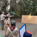 A Cub Scout shoots an Arrow of Light at the Crossover Ceremony, signifying the transition to Scouts BSA Troop 294 (Courtesy Photo).