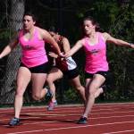 Lena Puz handing off the baton to Amelia Medeiros during the girls 4x100 meter relay (Tony Puz Photo).