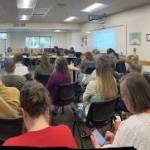 A standing-room-only audience filled the districts small conference room at an April 27 school board meeting (Elizabeth Shepherd photo).
