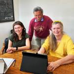 Windermere Vashon owners (left to right) Sophia de Groen Stendahl, John de Groen and Denise Katz, in their office (Elizabeth Shepherd Photo).