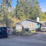 A house in Vashons Fir Ridge neighborhood, on the block where deputies say the crime took place, was sealed off with crime tape the afternoon of the arrest (Elizabeth Shepherd Photo).