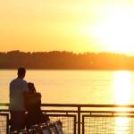 Two ferry riders enjoy the sunset and each others company on the ride from Tahlequah to Pt. Defiance last September (Alex Bruell Photo).