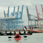 Logan Price photo
Coast Salish Water Warriors from the Puyallup and Nisqually nations keep a healthy distance from a U.S. Coast Guard vessel on Nov. 6, during a land and sea-based protest at the Port of Tacoma. Vashon islanders were among those who attended the protest by water to lend support.