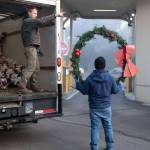 Eloy Carrillo and Nate Schafer distribute Island Christmas decorations for installation and hanging for the Vashon Chamber of Commerce. Terry Donnelly photo