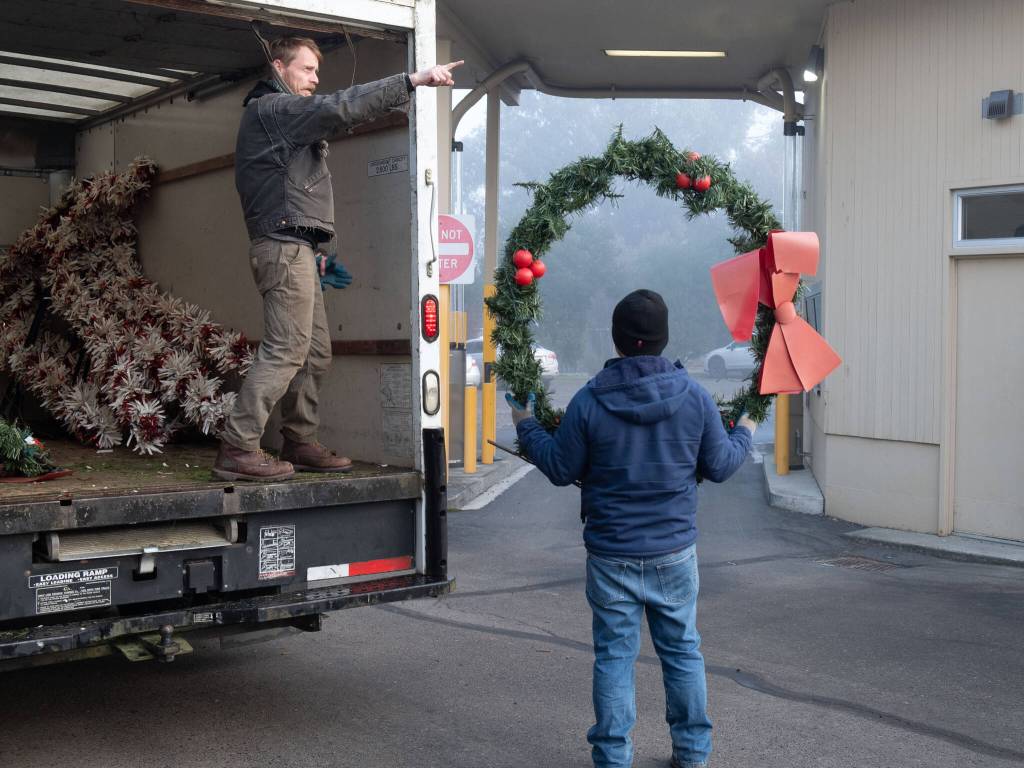 Eloy Carrillo and Nate Schafer distribute Island Christmas decorations for installation and hanging for the Vashon Chamber of Commerce. Terry Donnelly photo