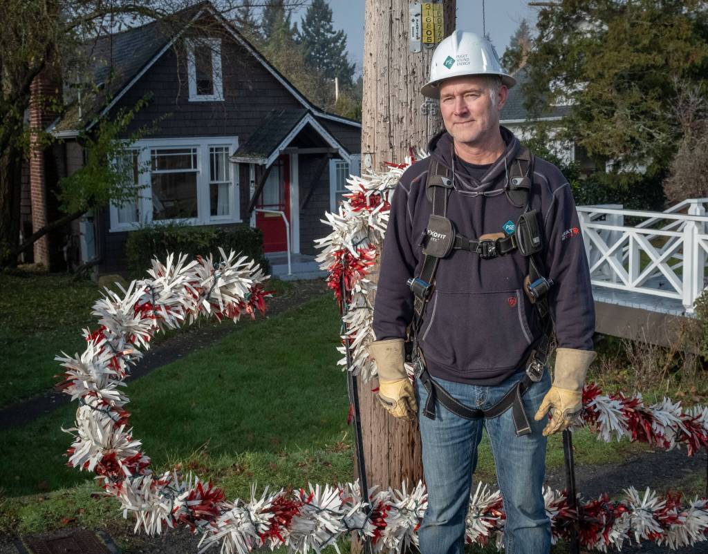 Puget Sound Energy employee Wes Peterson is part of the team that wires the islands iconic candy canes. Terry Donnelly photo