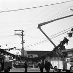 From 1963: Crews string up the lighted garlands that criss-crossed Vashon Highway before the candy canes were purchased in 1971. Photo courtesy Vashon Heritage Museum