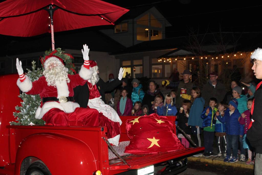 Alex Bruell photo
Santa and Mrs. Claus wave to the crowd at WinterFest.