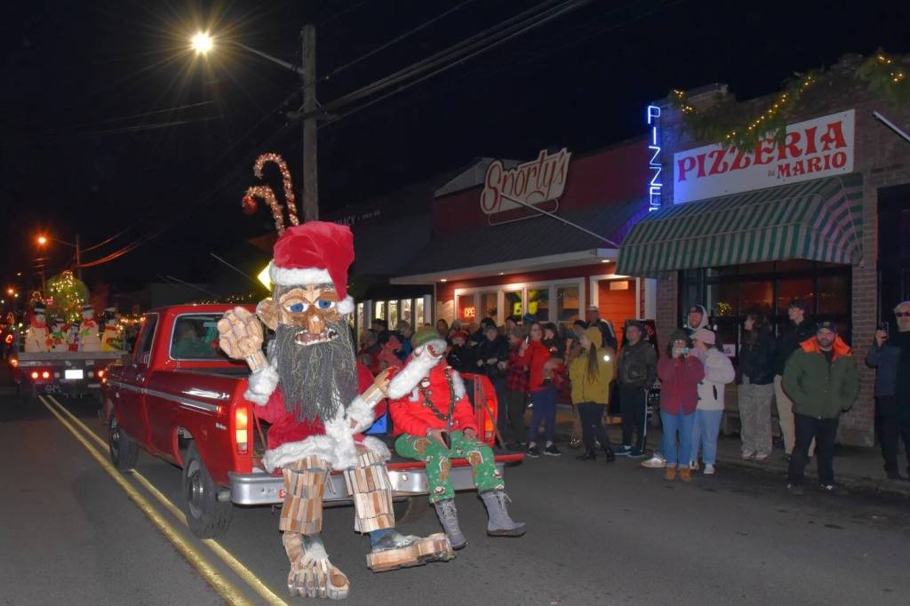 Jim Diers photo
Matt Beursken, as a Christmas-clad Edgar the Forest King (inspired by Vashons own Oscar the Bird King) rolls down Vashon Highway SW.