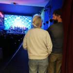Hilary Emmer, (left) the current president of the Interfaith Council to Prevent Homelessness, and Mike Ivaska, the lead pastor of Vashon Island Community Church and a member of the board and care team of the Council, surveying the crowd that gathered for the benefit concert (Elizabeth Shepherd Photo).