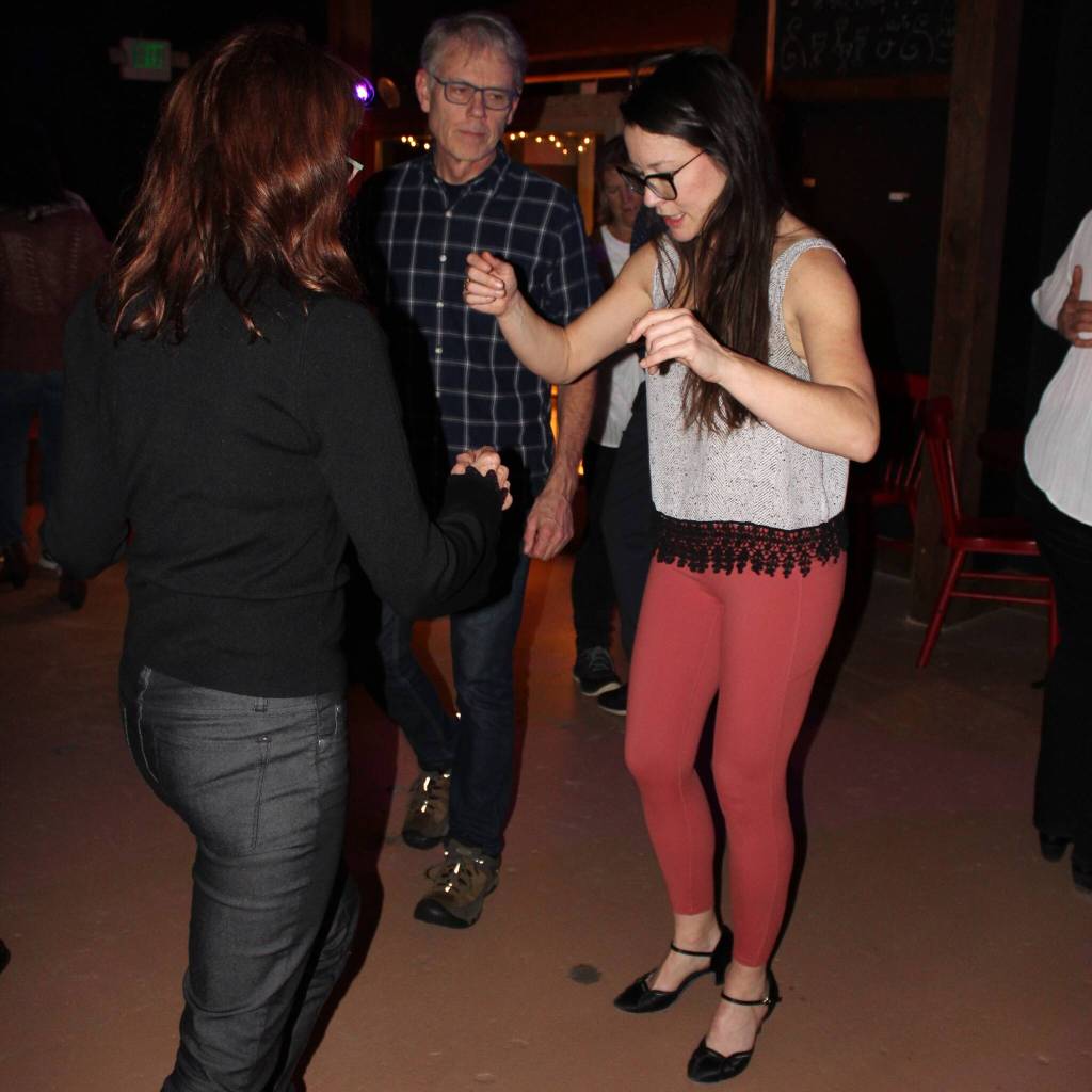 Alex Bruell photo
Sarah Howard demonstrates some steps to dancers at the Black Cat Cabaret.