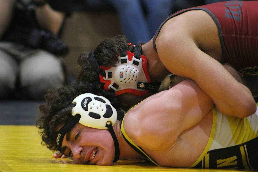 Vashon High School Senior Jonah Hendon (left) competes during The Rock Wrestling Tournament on Dec. 29. Alex Bruell photo
