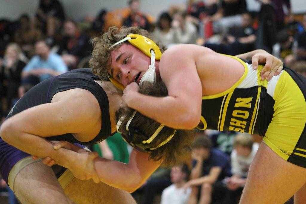 Vashon High School Senior Michael Ryland (right) competes during The Rock Wrestling Tournament on Dec. 29. Alex Bruell photo