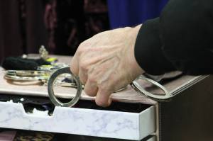 Alex Bruell photo
A shopper peruses a pair of handcuffs.