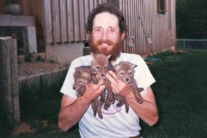 Courtesy photo
Brooks Fahy in Oregon,1987, holds three coyote pups orphaned by a government trapper. They were ultimately released successfully into the wild.