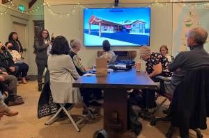 Elizabeth Shepherd 

Esther Lucero, standing with microphone, at the March 21 meeting of Vashon-Maury Island Community Council.