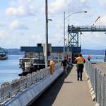 A ferry pulls toward the Fauntleroy ferry dock on a cloud-pocked March afternoon (Alex Bruell Photo).