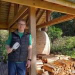 Chip Giller holds a VR headset in his hand at his island home (Leslie Brown Photo).