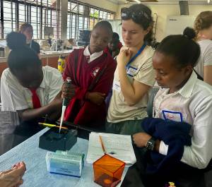 Courtesy photo
Vashon student Selene Dalinis and Kenyan students load gels for DNA analysis in a classroom lab in Kenya.