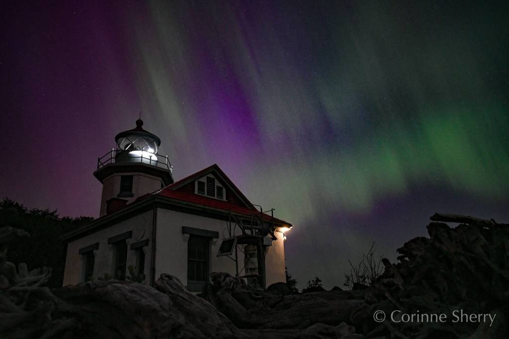 The aurora borealis shimmers behind the Point Robinson Lighthouse (Corinne Sherry photo).